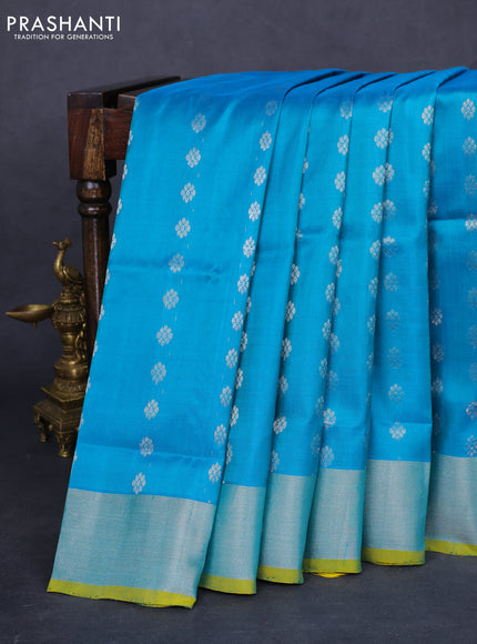 Pure uppada silk saree teal blue and yellow with allover silver zari woven floral buttas and silver zari woven border