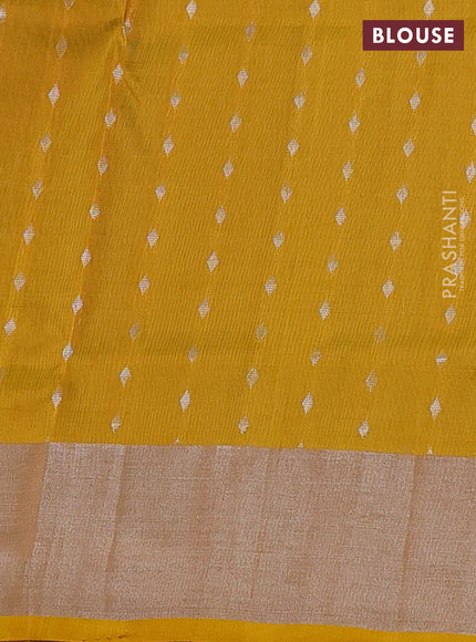 Pure uppada silk saree teal blue and yellow with allover silver zari woven floral buttas and silver zari woven border