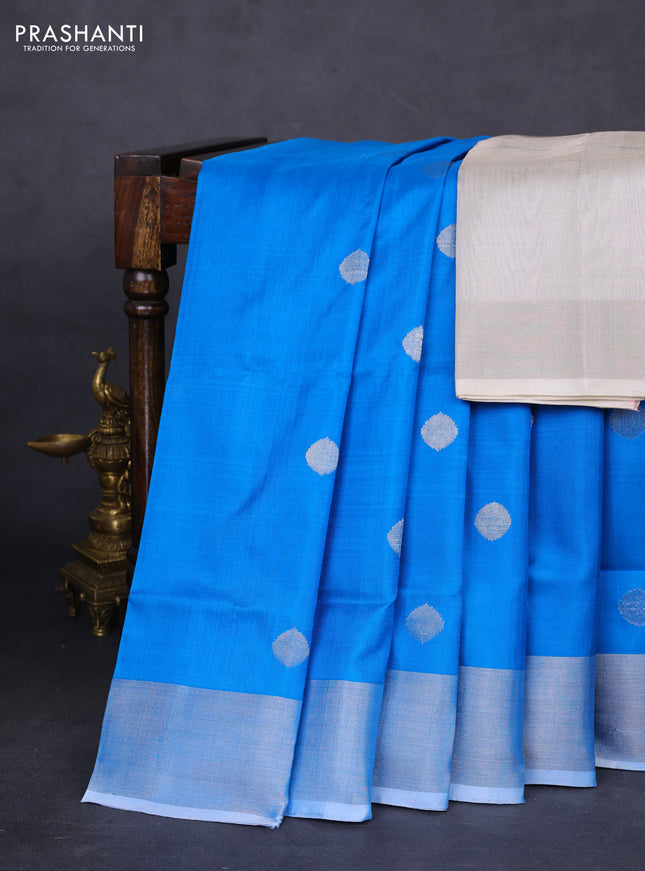 Pure uppada silk saree cs blue with silver zari woven coin buttas and silver zari woven border