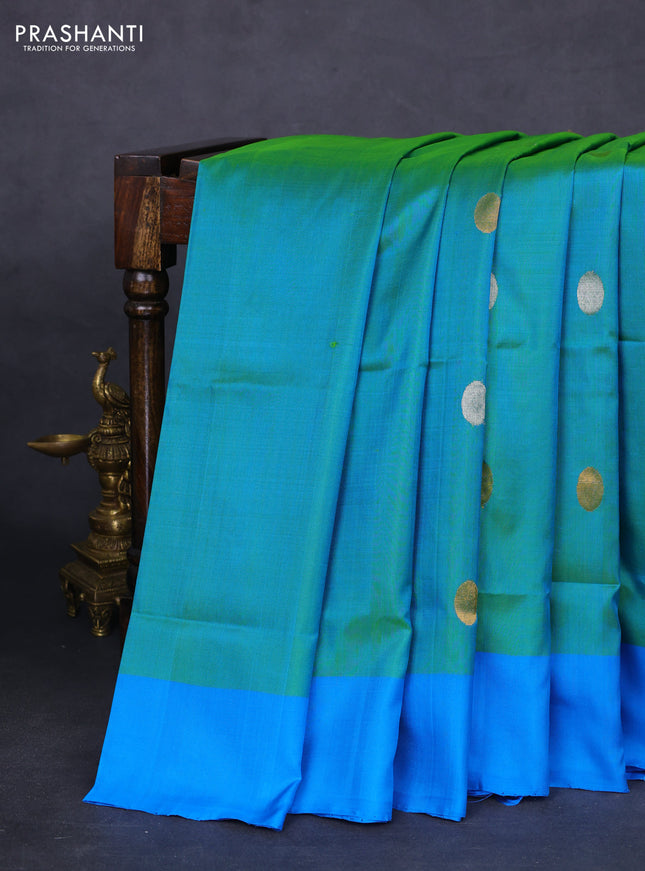 Pure uppada silk saree dual shade of teal bluish green and cs blue with silver & gold zari woven coin buttas and simple border