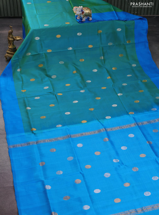 Pure uppada silk saree dual shade of teal bluish green and cs blue with silver & gold zari woven coin buttas and simple border