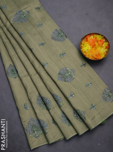 Semi raw silk saree elaichi green with embroidery work buttas and embroidery butta border