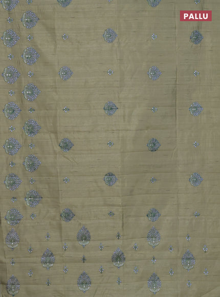 Semi raw silk saree elaichi green with embroidery work buttas and embroidery butta border