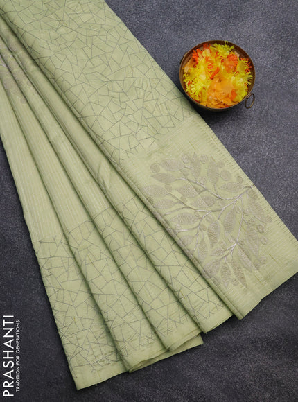 Semi raw silk saree mild pista green with embroidery work buttas and silver zari woven border