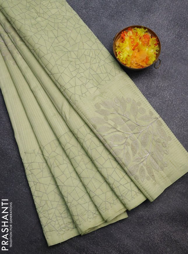 Semi raw silk saree mild pista green with embroidery work buttas and silver zari woven border