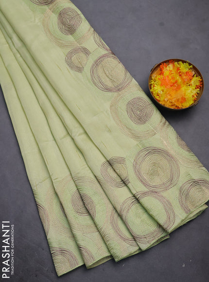 Semi raw silk saree mild pista green with embroidery work buttas and geometric design embroidery border