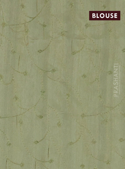 Semi raw silk saree mild pista green with embroidery work buttas and geometric design embroidery border