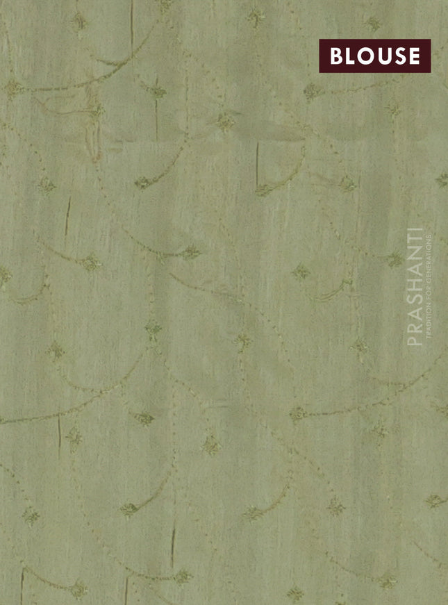 Semi raw silk saree mild pista green with embroidery work buttas and geometric design embroidery border