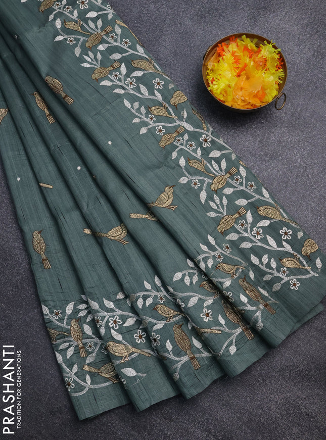 Semi raw silk saree green shade with embroidery work buttas and embroidery border