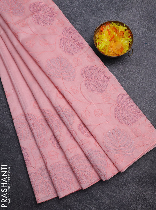 Semi raw silk saree peach shade with allover embroidery and leaf design embroidery border