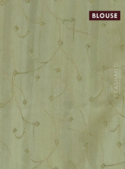 Semi raw silk saree pista green with embroidery work buttas and geometric design embroidery border