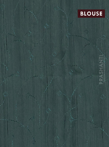 Semi raw silk saree green shade with embroidery work buttas and geometric design embroidery border