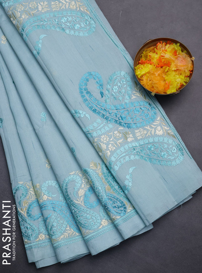 Semi raw silk saree pastel blue with embroidery work buttas and paisley design embroidery border