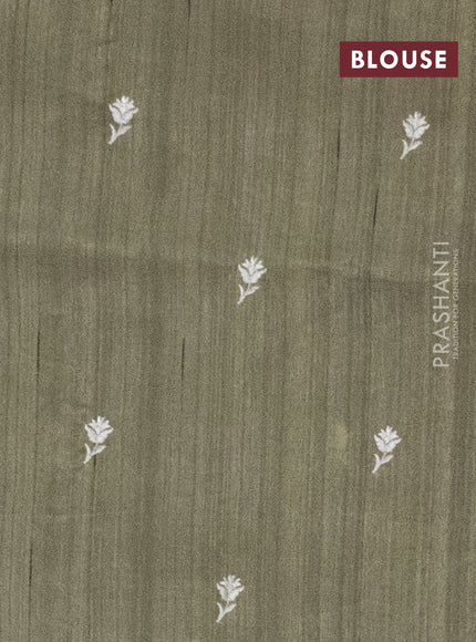 Semi raw silk saree sap green with embroidery work buttas and paisley design embroidery border