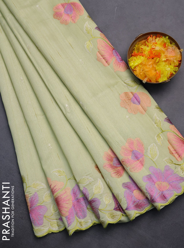 Semi raw silk saree pista green with embroidery work buttas and floral embroidery border