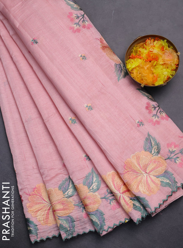 Semi raw silk saree peach shade with embroidery work buttas and floral embroidery border