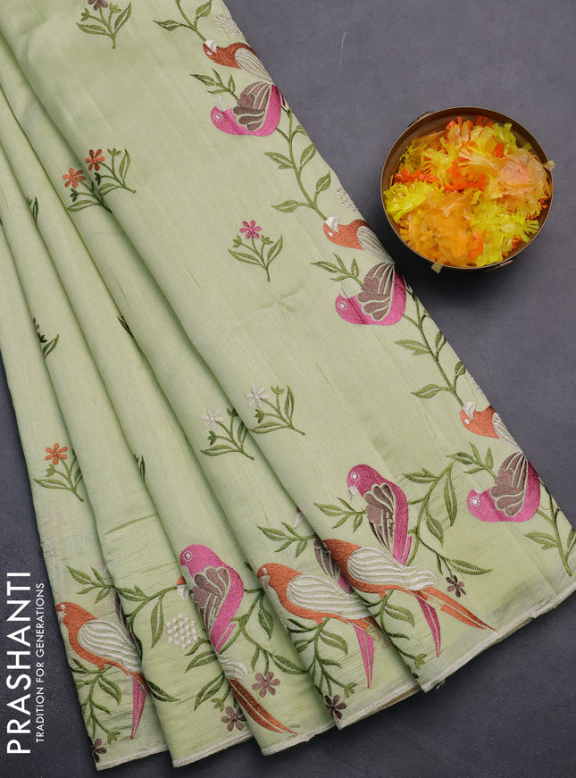 Semi raw silk saree pista green with embroidery work buttas and parrot design embroidery butta border