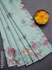 Semi raw silk saree pastel green with embroidery work buttas and parrot design embroidery butta border