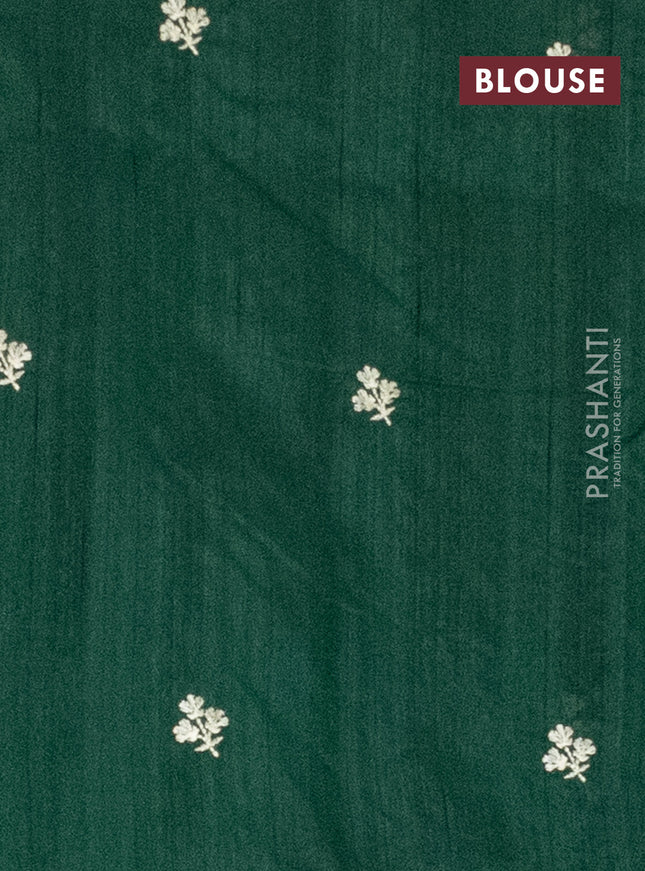 Semi raw silk saree bottle green with embroidery work buttas and floral embroidery border