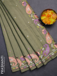 Semi raw silk saree sap green shade with embroidery work buttas and embroidery border