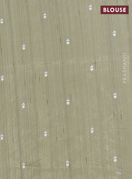 Semi raw silk saree sap green shade with embroidery work buttas and embroidery border