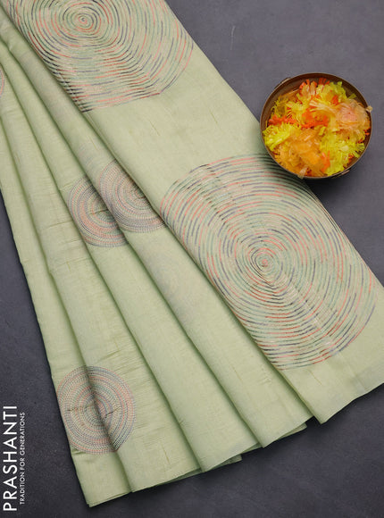 Semi raw silk saree pista green with embroidery work buttas and geometric embroidery butta border