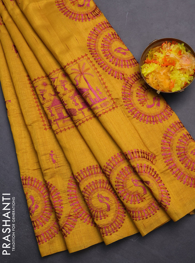 Semi raw silk saree mustard yellow with embroidery work buttas and warli design embroidery border