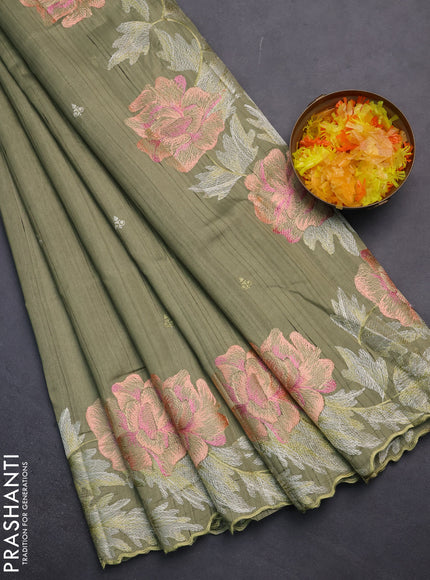 Semi raw silk saree sap green with embroidery work buttas and floral embroidery border