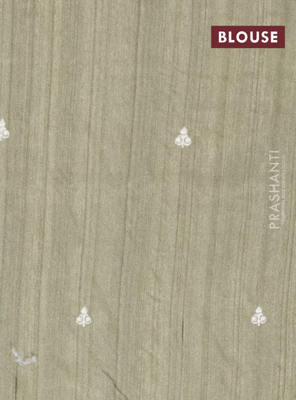 Semi raw silk saree sap green with embroidery work buttas and floral embroidery border