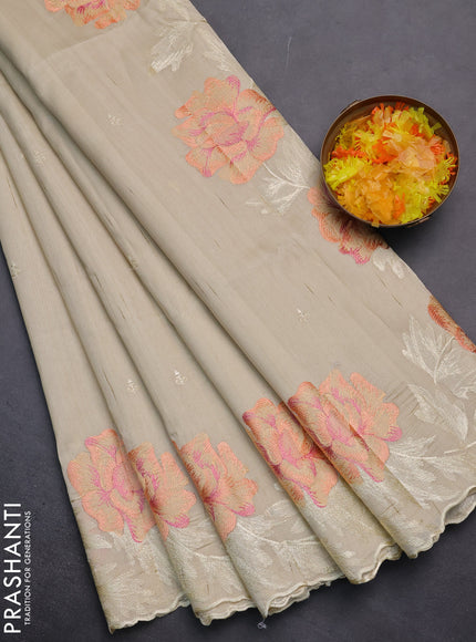 Semi raw silk saree cream with embroidery work buttas and floral embroidery border
