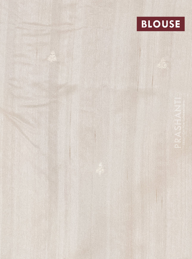 Semi raw silk saree cream with embroidery work buttas and floral embroidery border