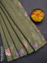 Semi raw silk saree sap green with embroidery work buttas and floral embroidery border