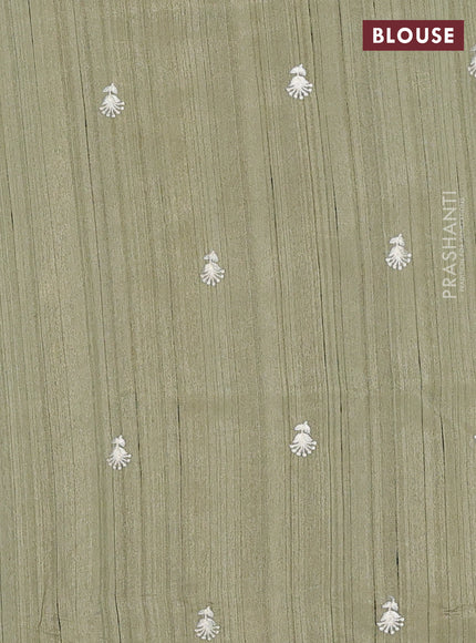 Semi raw silk saree sap green with embroidery work buttas and floral embroidery border