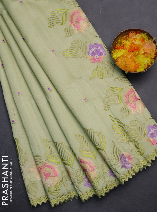 Semi raw silk saree pista green with embroidery work buttas and floral embroidery border