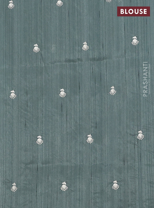 Semi raw silk saree green shade with embroidery work buttas and floral embroidery border