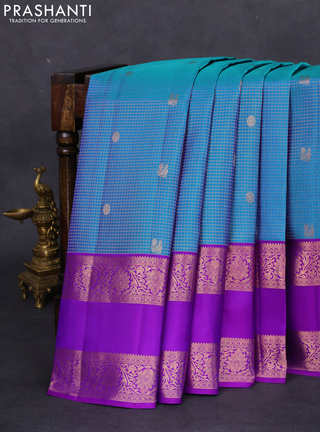 Pure kanchipuram silk saree dual shade of blue and purple with allover zari woven brocade weaves and rettapet copper zari woven border