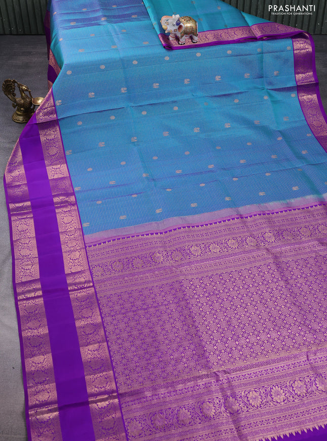 Pure kanchipuram silk saree dual shade of blue and purple with allover zari woven brocade weaves and rettapet copper zari woven border
