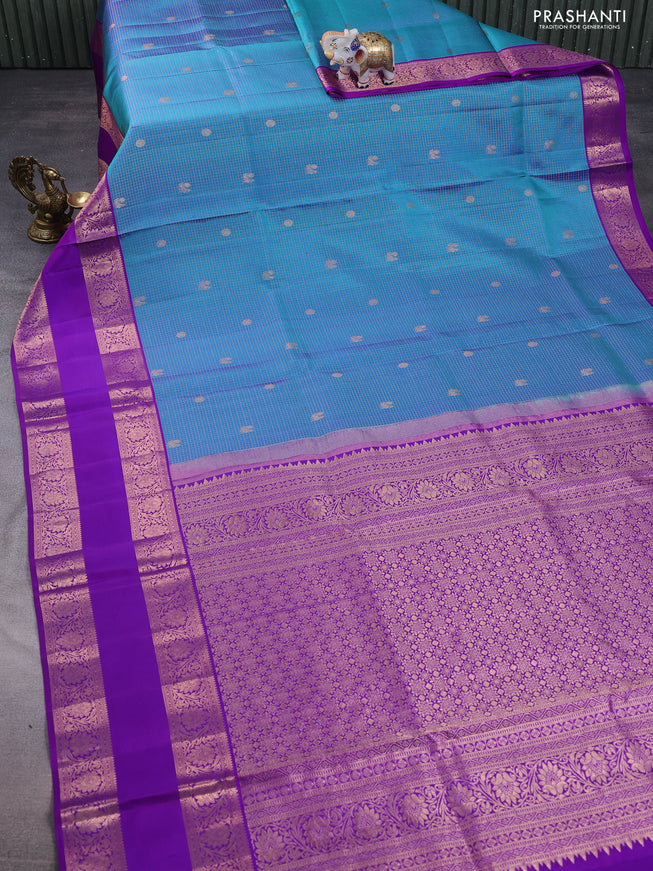 Pure kanchipuram silk saree dual shade of blue and purple with allover zari woven brocade weaves and rettapet copper zari woven border