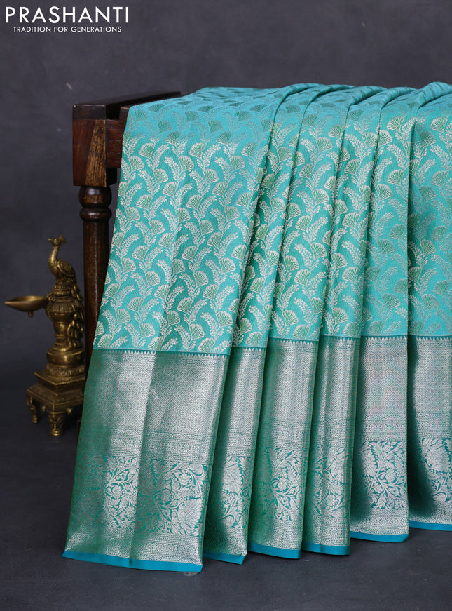 Pure kanchipuram silk saree teal blue and peacock green with allover silver zari woven brocade weaves and long rich zari woven border