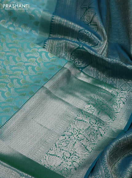 Pure kanchipuram silk saree teal blue and peacock green with allover silver zari woven brocade weaves and long rich zari woven border