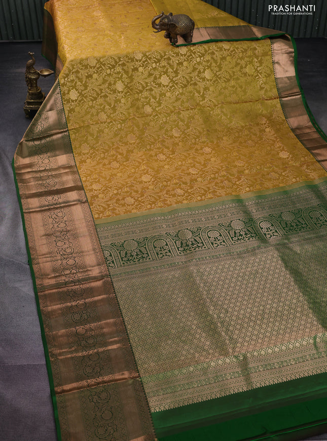Pure kanchipuram silk saree mustard yellow and green with allover zari woven floral brocade weaves and long rich zari woven border