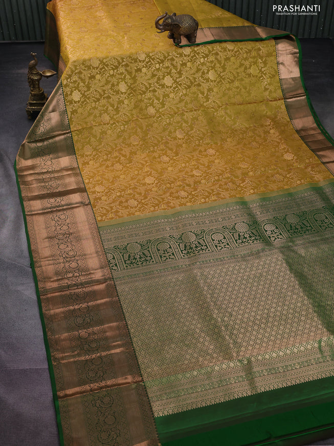 Pure kanchipuram silk saree mustard yellow and green with allover zari woven floral brocade weaves and long rich zari woven border