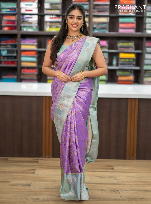 Pure kanchipuram silk saree lavender and pastel green with allover silver & copper zari woven brocade weaves and long silver zari woven bird butta border