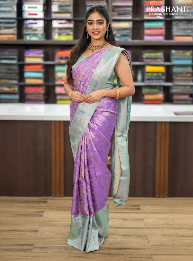 Pure kanchipuram silk saree lavender and pastel green with allover silver & copper zari woven brocade weaves and long silver zari woven bird butta border