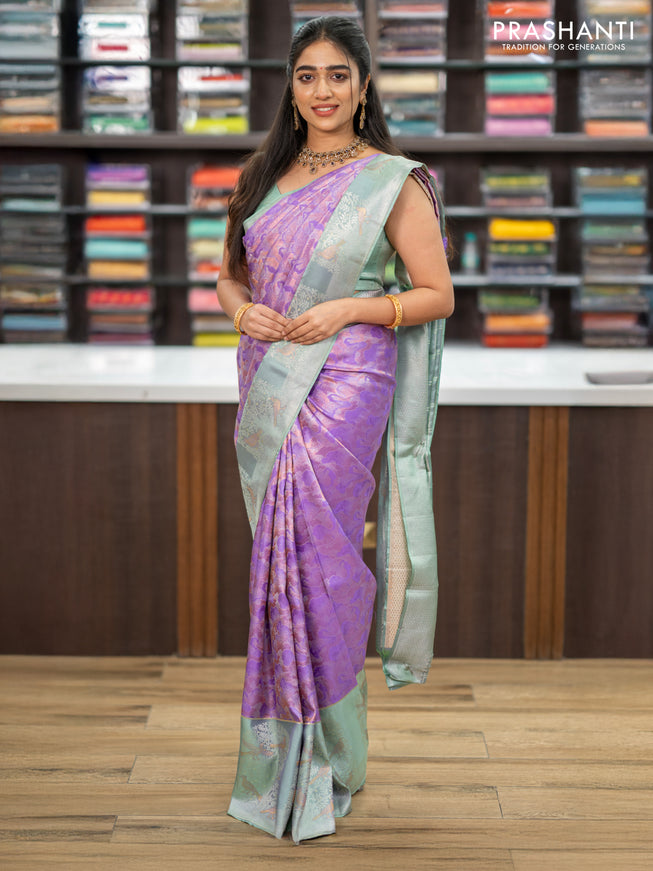 Pure kanchipuram silk saree lavender and pastel green with allover silver & copper zari woven brocade weaves and long silver zari woven bird butta border
