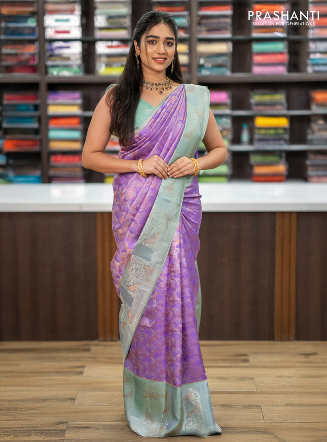 Pure kanchipuram silk saree lavender and pastel green with allover silver & copper zari woven brocade weaves and long silver zari woven bird butta border