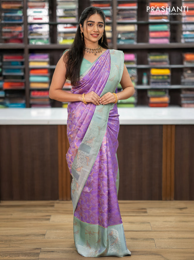 Pure kanchipuram silk saree lavender and pastel green with allover silver & copper zari woven brocade weaves and long silver zari woven bird butta border