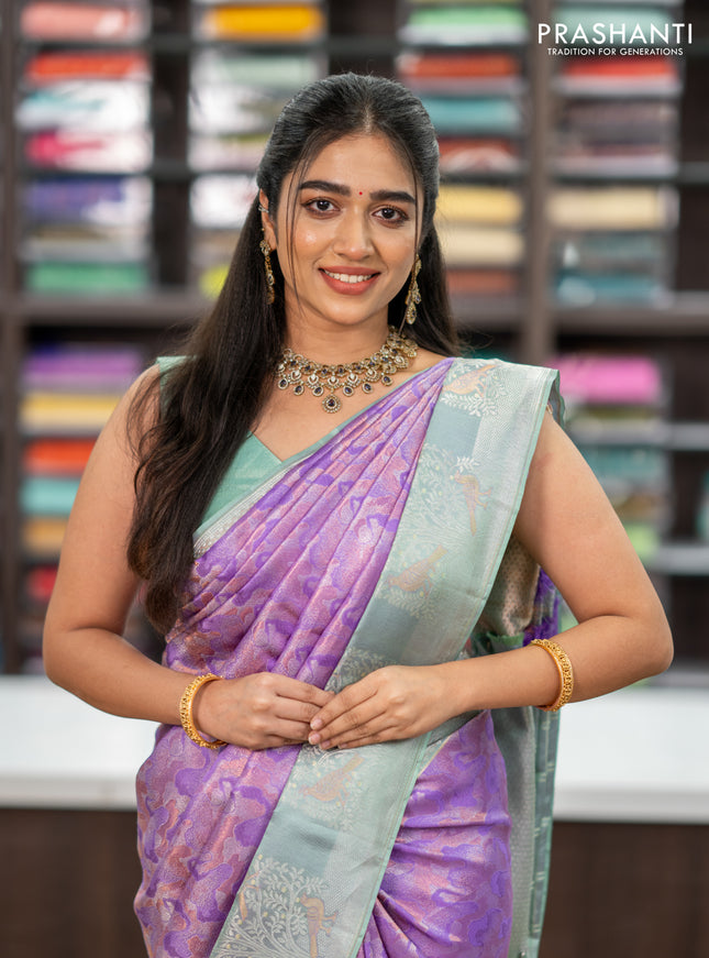 Pure kanchipuram silk saree lavender and pastel green with allover silver & copper zari woven brocade weaves and long silver zari woven bird butta border