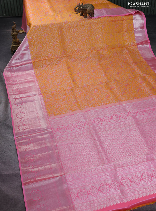 Pure kanchipuram silk saree mango yellow and light pink with allover silver zari woven brocade weaves and long silver zari woven border