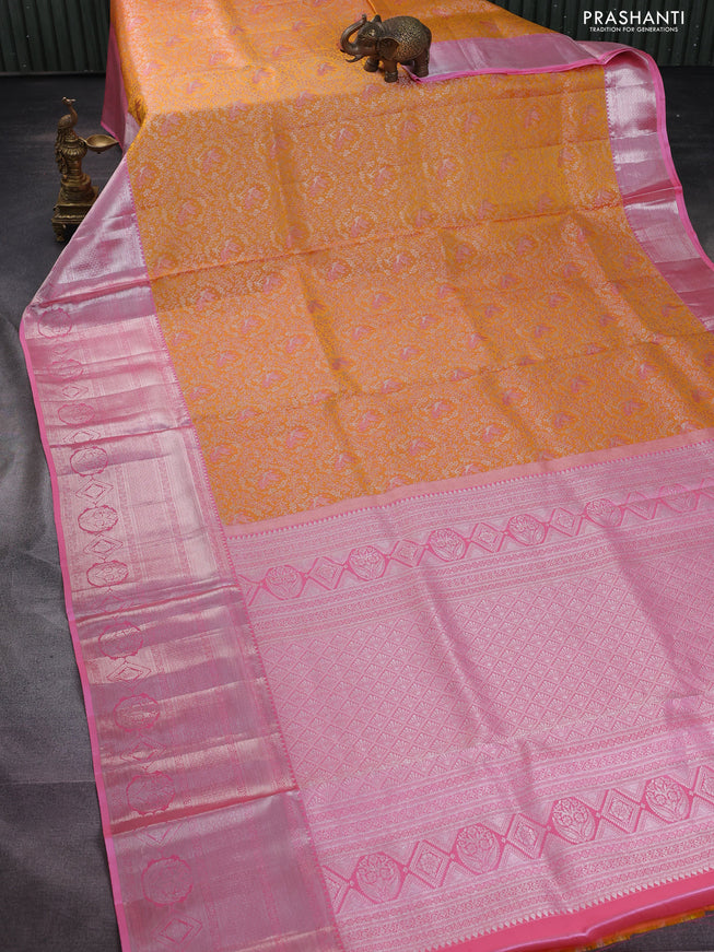Pure kanchipuram silk saree mango yellow and light pink with allover silver zari woven brocade weaves and long silver zari woven border